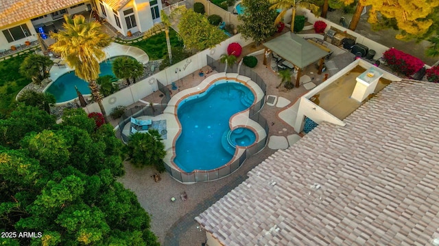 view of pool featuring an outdoor hot tub