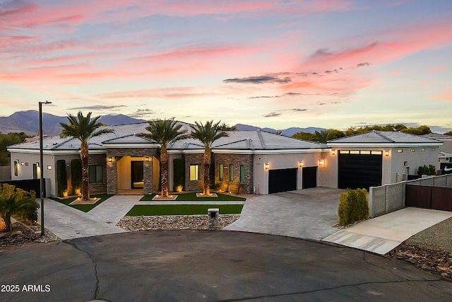 view of front of house featuring a mountain view and a garage