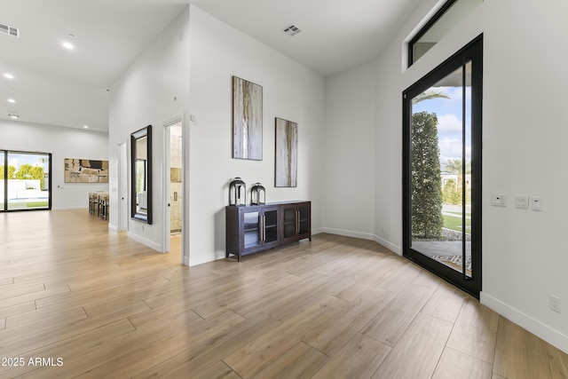 interior space with plenty of natural light and light hardwood / wood-style floors