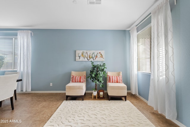 sitting room featuring tile patterned flooring