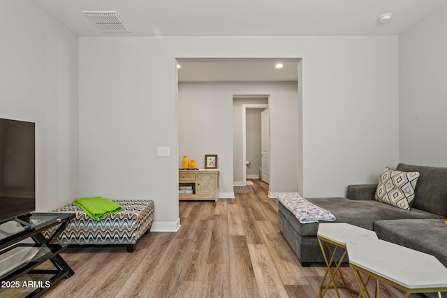 living room with light hardwood / wood-style flooring