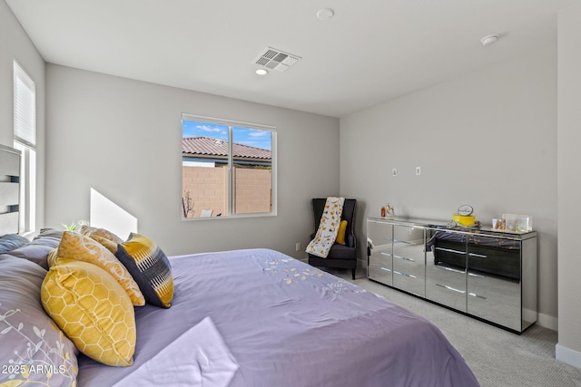 bedroom featuring light colored carpet