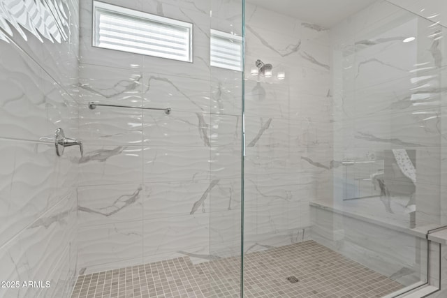 bathroom featuring a tile shower