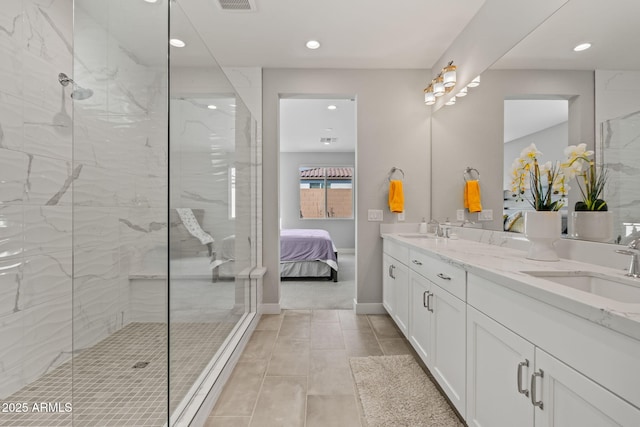 bathroom featuring vanity and a tile shower