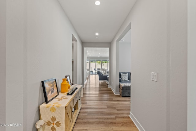 hallway featuring light hardwood / wood-style flooring