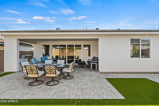 rear view of house featuring an outdoor hangout area and a patio area