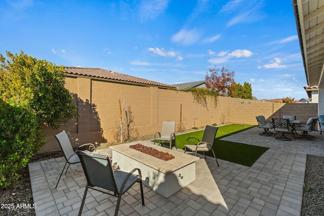 view of patio / terrace featuring an outdoor fire pit