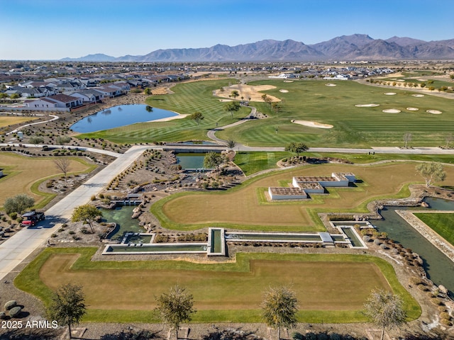 aerial view featuring a water and mountain view