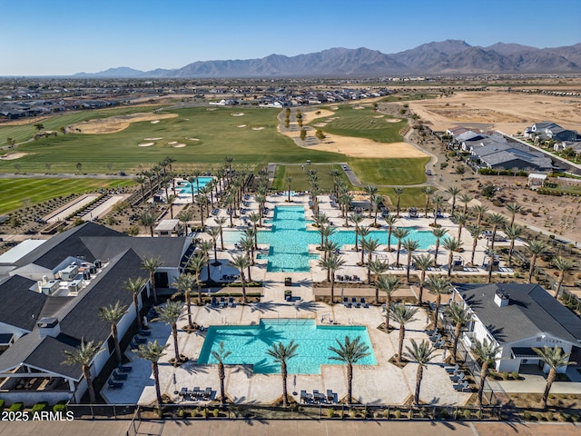 birds eye view of property with a mountain view