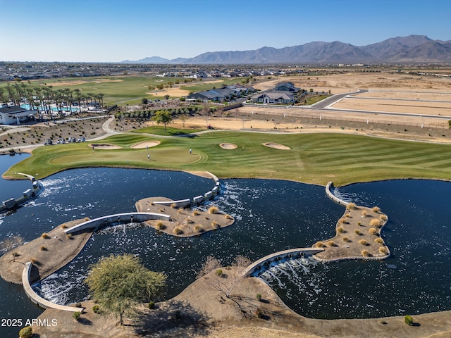 birds eye view of property with a water and mountain view