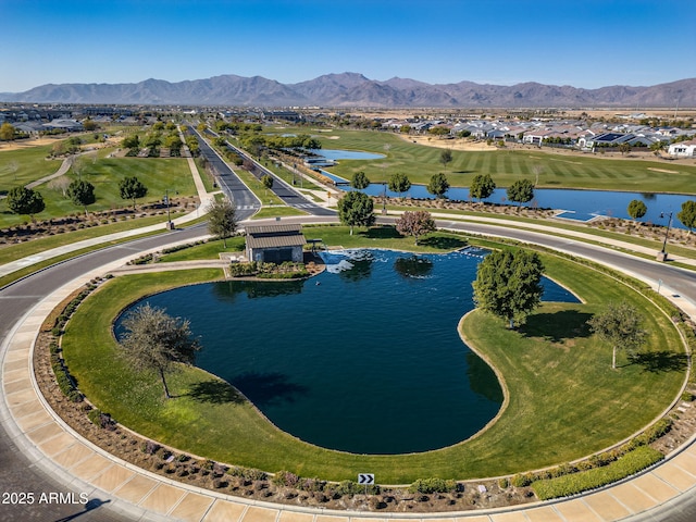 aerial view featuring a water and mountain view