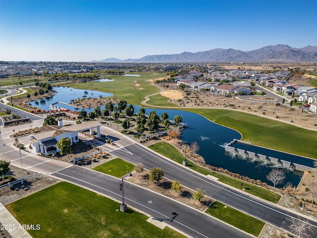 birds eye view of property featuring a water and mountain view