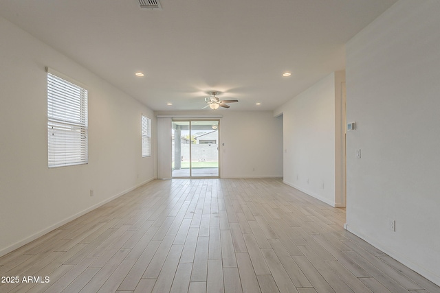 unfurnished room featuring a ceiling fan, light wood-type flooring, baseboards, and recessed lighting
