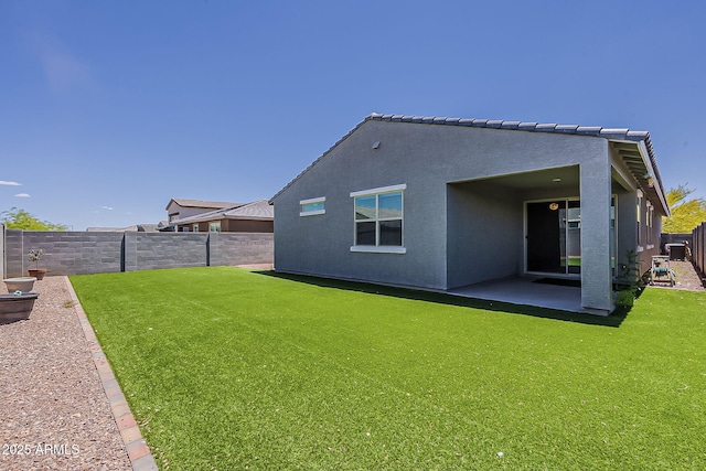 rear view of property with a patio and stucco siding