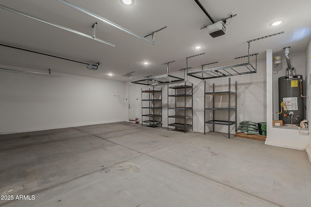 garage featuring gas water heater, a garage door opener, recessed lighting, and baseboards