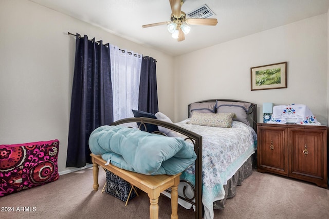 bedroom with light carpet and ceiling fan