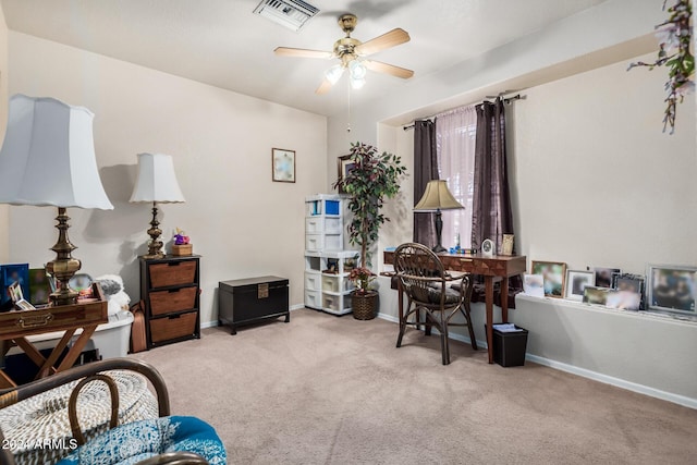 living area with ceiling fan and light carpet