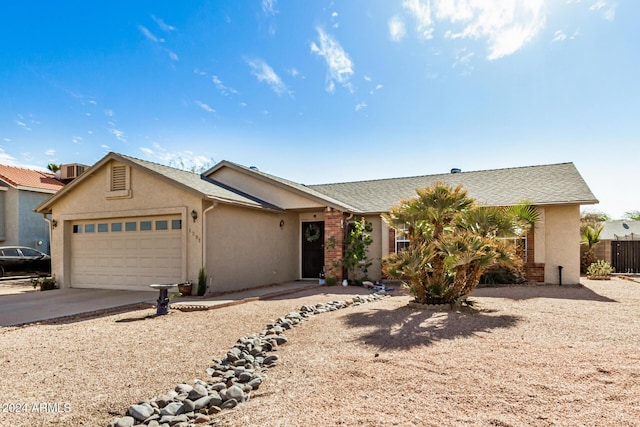 ranch-style home featuring a garage