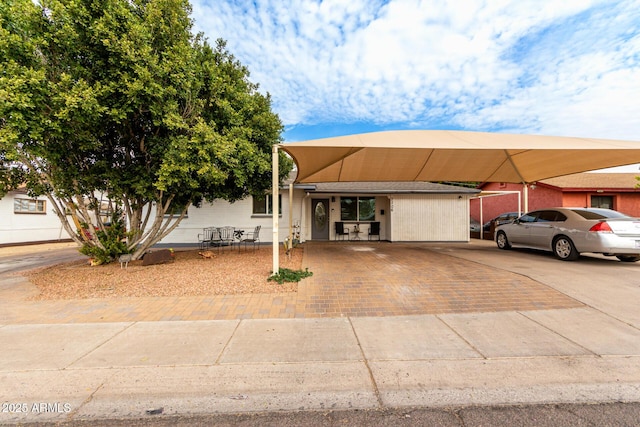 view of front of property with a carport