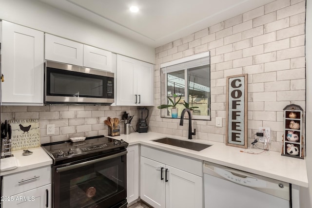 kitchen with white cabinetry, dishwasher, sink, decorative backsplash, and black electric range