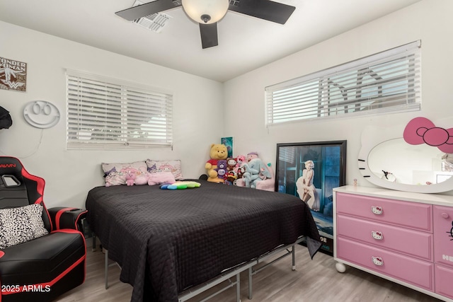 bedroom featuring ceiling fan and light hardwood / wood-style floors