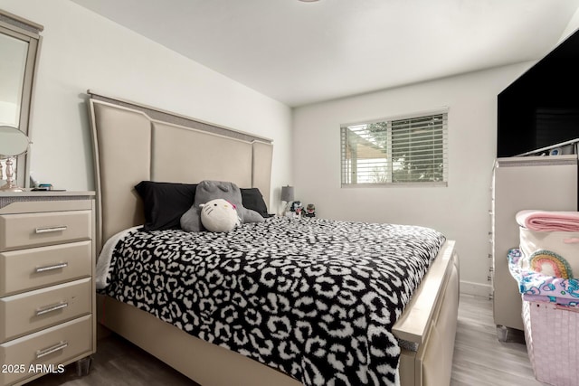 bedroom with light wood-type flooring