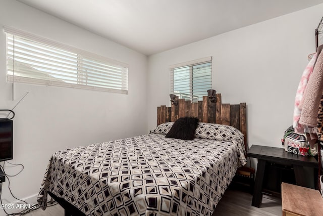 bedroom with hardwood / wood-style floors