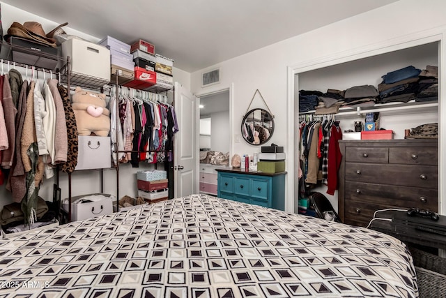 bedroom featuring two closets