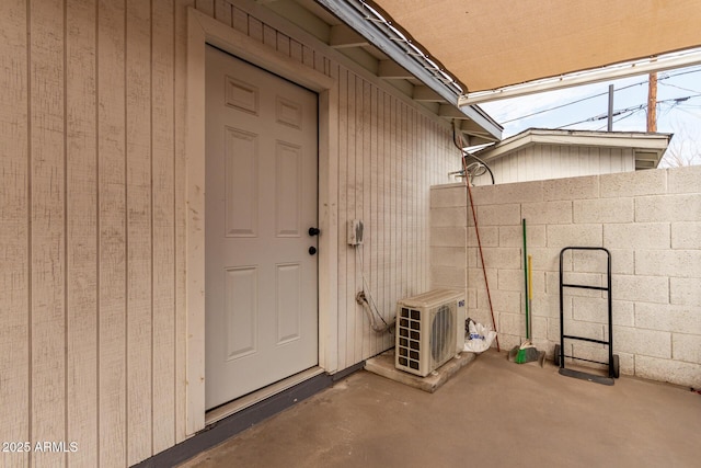 view of exterior entry with ac unit