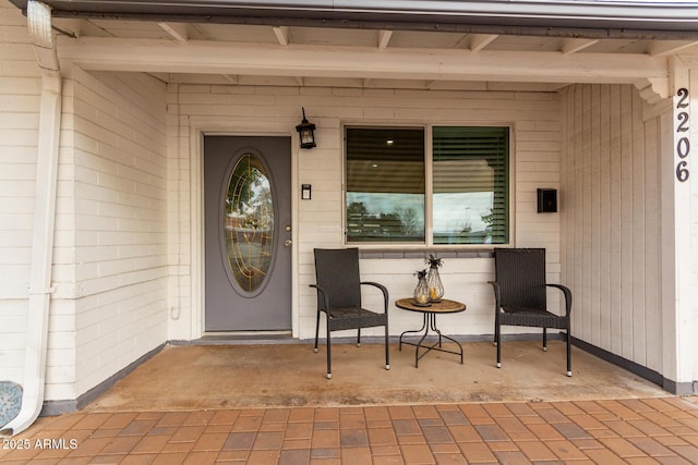 doorway to property featuring a patio area