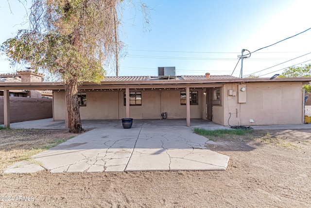 back of house featuring a patio area and cooling unit