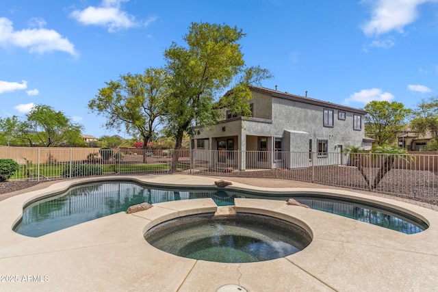 view of swimming pool featuring a patio, an in ground hot tub, fence, and a fenced in pool