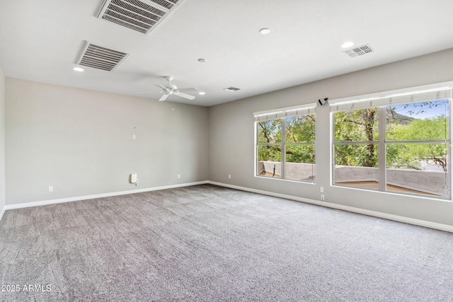 unfurnished room featuring baseboards, visible vents, and carpet flooring