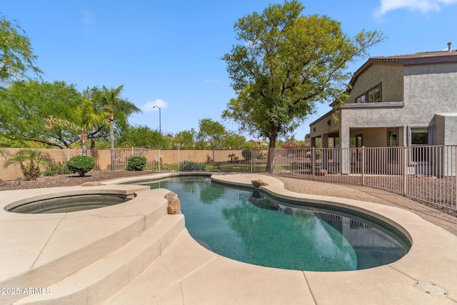 view of pool with a fenced backyard, a fenced in pool, an in ground hot tub, and a patio