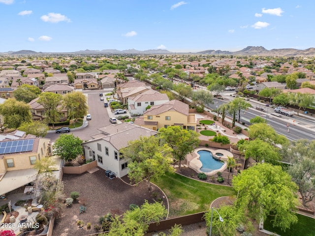 drone / aerial view featuring a residential view and a mountain view