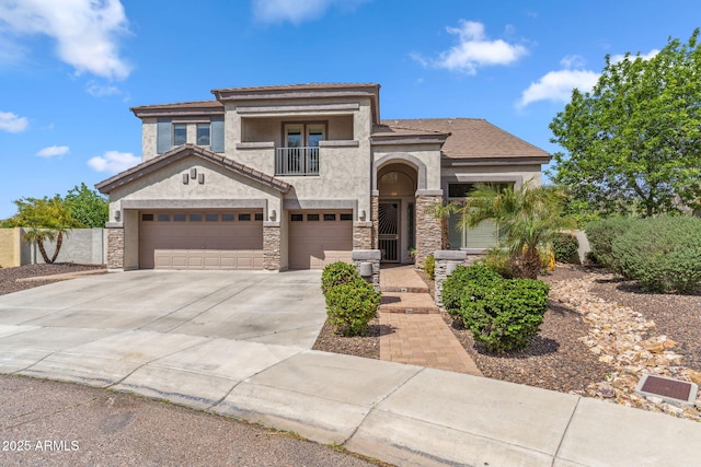 view of front of house featuring a balcony, stone siding, concrete driveway, and stucco siding