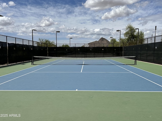 view of sport court featuring community basketball court and fence