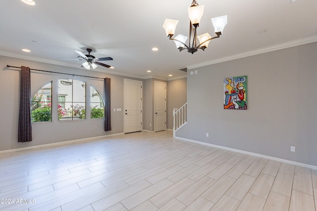 empty room with light hardwood / wood-style floors, ornamental molding, and ceiling fan with notable chandelier