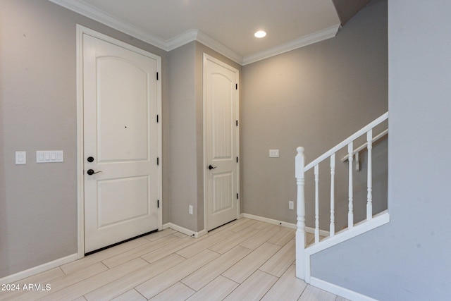 entryway featuring ornamental molding