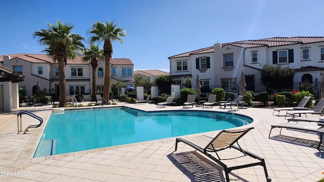 view of swimming pool featuring a patio area