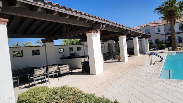 view of swimming pool featuring a gazebo and a patio