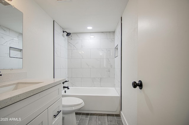 bathroom with shower / washtub combination, visible vents, toilet, vanity, and baseboards
