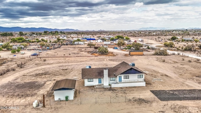 aerial view featuring view of desert and a mountain view