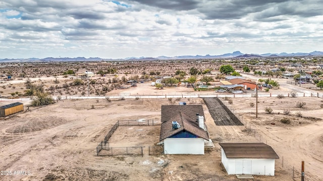 drone / aerial view with view of desert and a mountain view