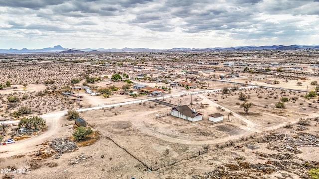 bird's eye view featuring a rural view, a desert view, and a mountain view