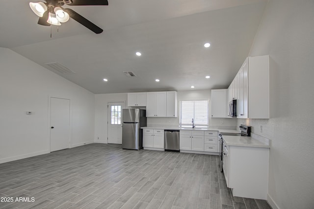 kitchen with visible vents, a sink, appliances with stainless steel finishes, and a healthy amount of sunlight