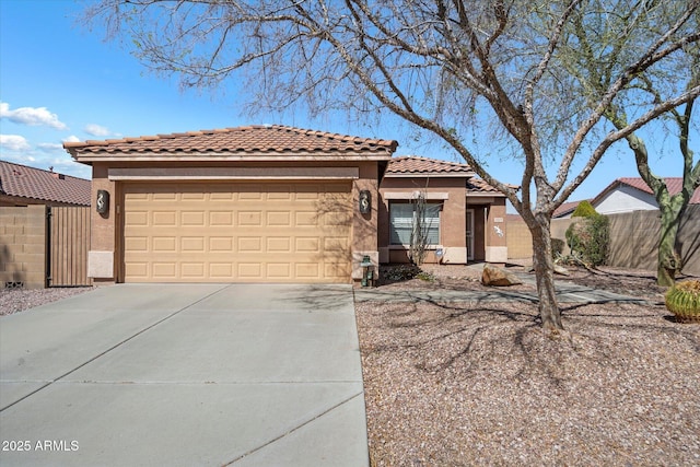 view of front of property featuring an attached garage, fence, a tiled roof, stucco siding, and driveway