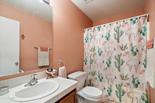 bathroom with visible vents, toilet, curtained shower, and vanity