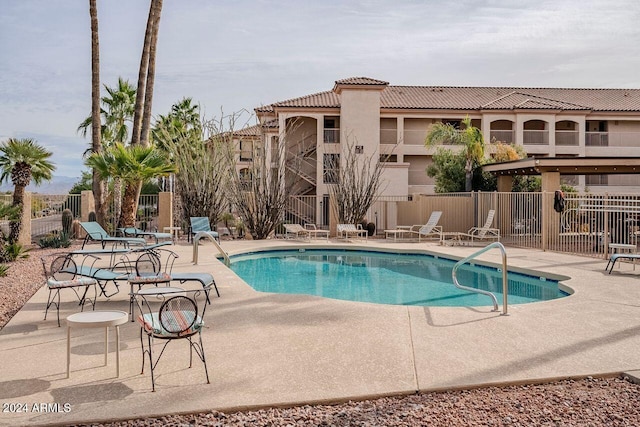 view of pool featuring a patio