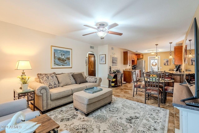 living room with ceiling fan